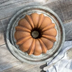 Nordic Ware Anniversary Bundt Pan | Gold -Baking pan Shop 50077 nordic ware anniversary bundt pan gold lifestlye bundt cake