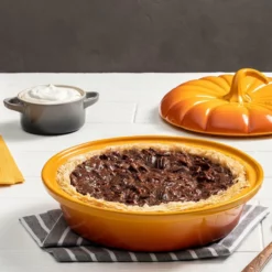 Le Creuset 9" Pumpkin Baker With Lid | Persimmon -Baking pan Shop rs17492 bourbon chocolate pecan pie 1